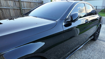 Glossy black car washed spot-free with DI water