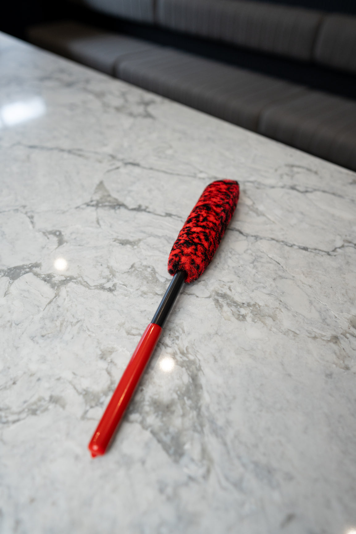 Close-up of soft synthetic wool bristles on wheel cleaning brush