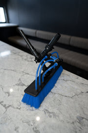Water fed pole brush head with blue bristles and water jets