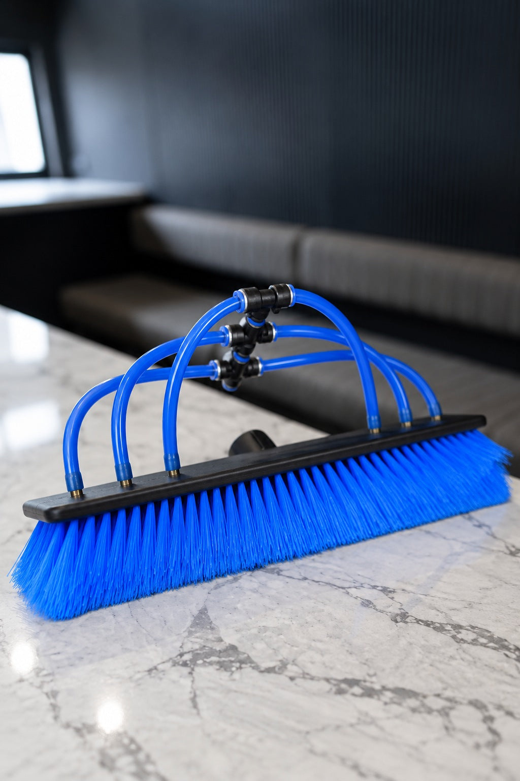 Side view of the 35cm blue nylon water fed pole brush showing the row of bristles