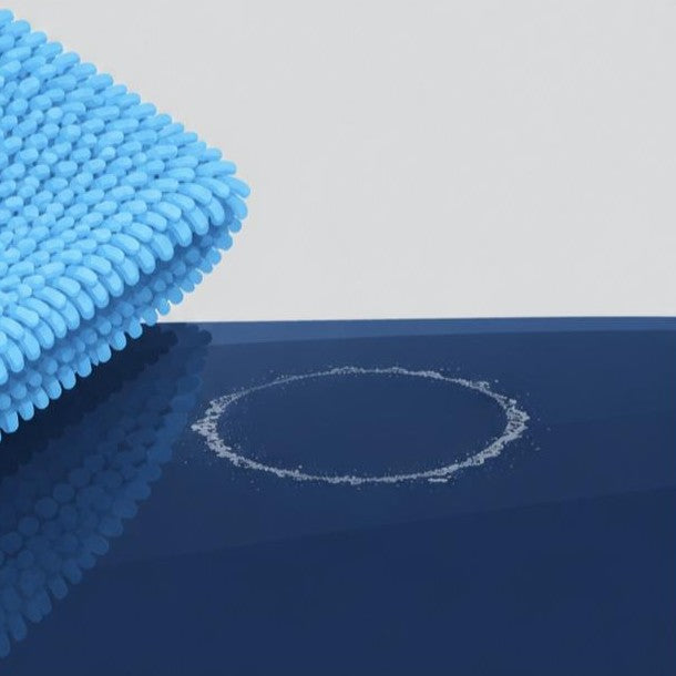 A cloth has wiped the white spot away but a thin mineral ring is still stuck to the paint