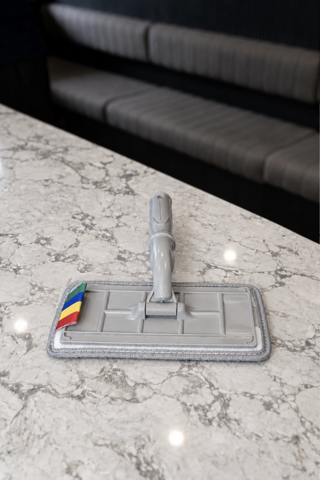 SFR Glide Pro swivel pad window washer with its microfibre pad fitted, on a marble benchtop