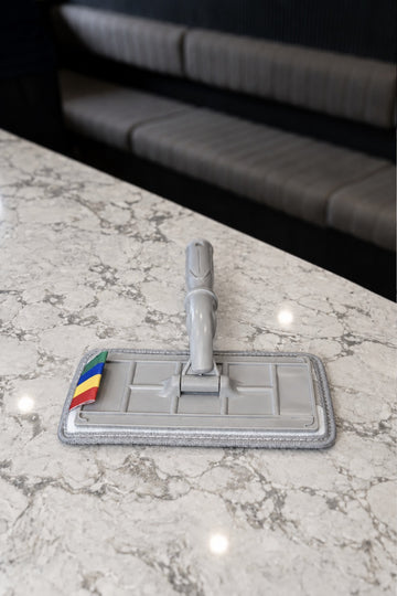 SFR Glide Pro swivel pad window washer with its microfibre pad fitted, on a marble benchtop