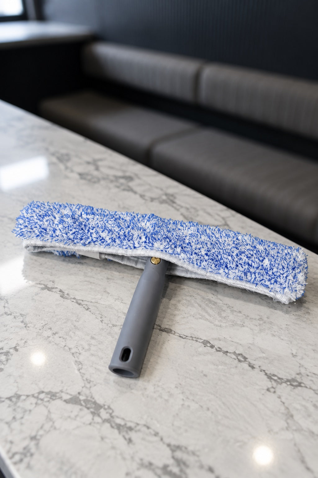 35cm swivel T-bar window washer with a blue and white microfibre sleeve on a marble benchtop